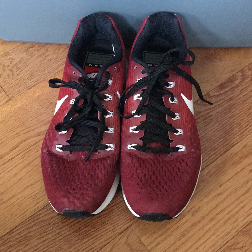 Maroon Nike running shoes
